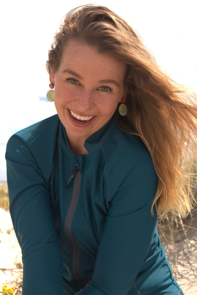 Teal coloured sunsmart full zip rashie for she/her in Econyl regenerated nylon.