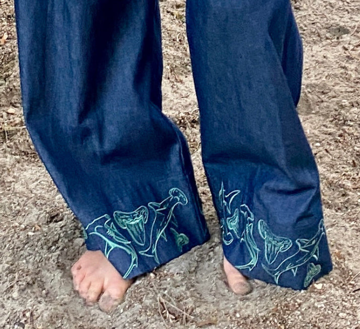 Hammerhead shark embroidered cuff detail on Women's wide-leg beach pants with a tie waist and generous pockets.