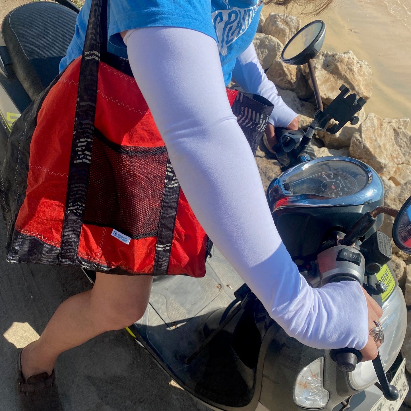 Ocean Remedy tote made from upcycled kite surfing kites and tropical weight UPF50 plus cotton knitted sun sleeves - perfect for beach clean ups and long days in the sun.