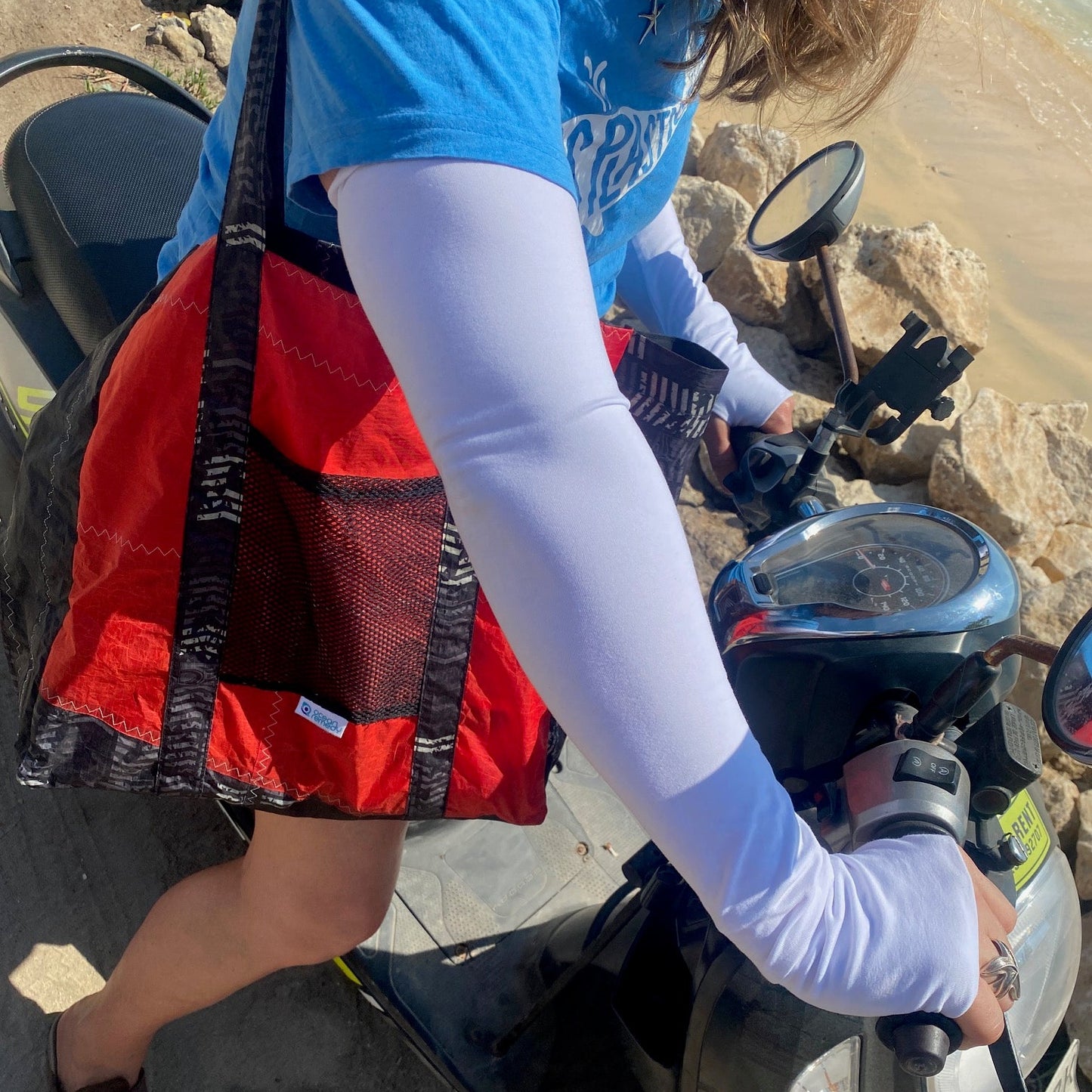 Sunsmart UPF50 plus sleeves for holidays, sport and beach clean ups plus a tote bag made from an upcycled kite. 
